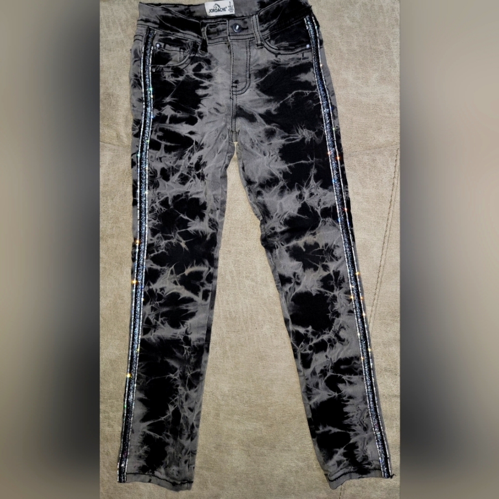 Girls Jeans size 7. Very cool black and gray with sparkle stripe down leg.